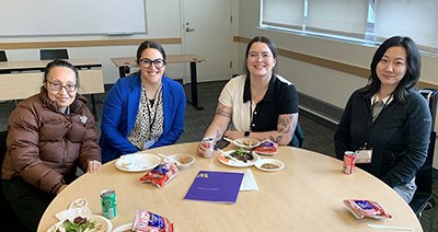 Attendees share lunch and discussion.