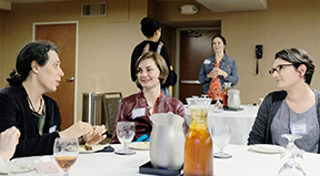 Jennifer Mankoff networks with computing students at a conference.