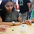 Image of a student conducting a science experiment in an oceanography lab