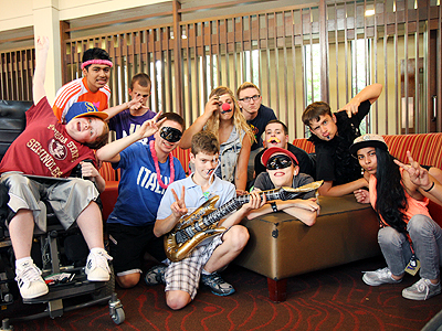 Image of a group of students posing for the camera on craft night