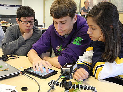 Image of three students using accessible technolog the EXO Labs