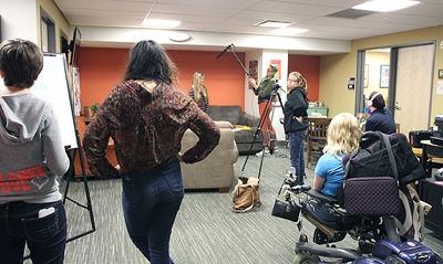 A group image of students working on a digital media project.