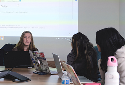 Postdoctoral student Cynthia Bennett teaches students computing.