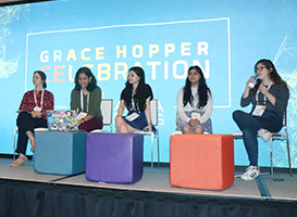 Five panelists sitting on the Grace Hopper Celebration stage.