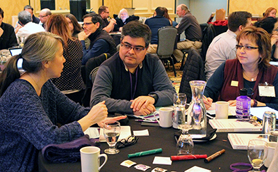 Three participants work together.