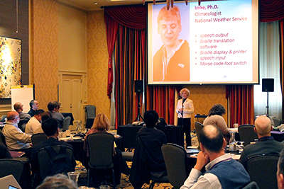 Sheryl Burgstahler presents in front of the group.