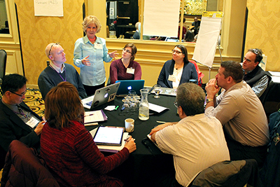 Sheryl Burgstahler and a group have a discussion.