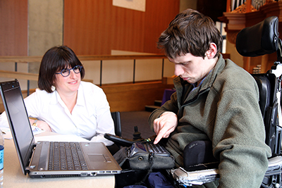 A student practices interview skills with a professional.