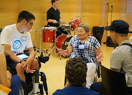 Ryan drumming in the background while Mentor Karen meets with Scholars. Ryan drumming in the background while Mentor Karen meets with Scholars.
