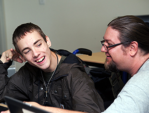 Image of a faculty member consulting a student