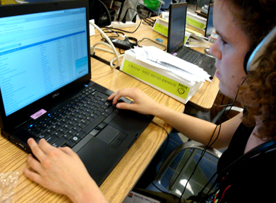 Student using laptop with accessible technology. Picture of student using laptop with accessible technology.
