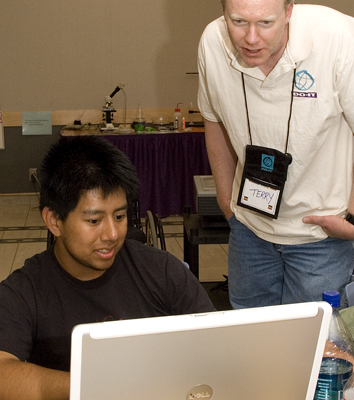 Student and instructor working on laptop. Photo of student and instructor working on laptop.