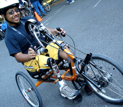 Student on an adaptive bike. Photo of a student on an adaptive bike.