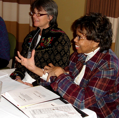 Photo of two faculty members in a conversation.