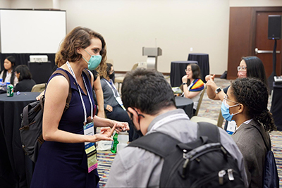 Stacy Branham talking to participants at the Tapia Conference. Stacy Branham talking to participants at the Tapia Conference.
