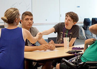 A student shakes hands after an interview.