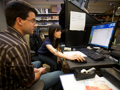 Image of two students working together on a computer