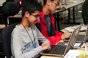 Image of student working on a laptop in a computer lab