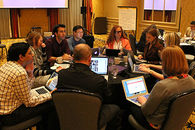 A large group all sit together discussing CIRCL.