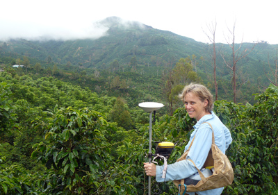 Picture of an AccessSTEM intern holding a GPS at a Costa Rica coffee plantation.