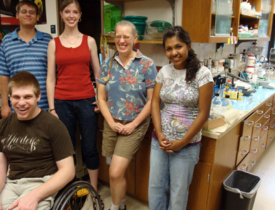 Group of students and science teacher in a lab. Picture of a group of students and a science teacher in a lab.