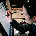 Image of a student using a large tablet for assistive technology