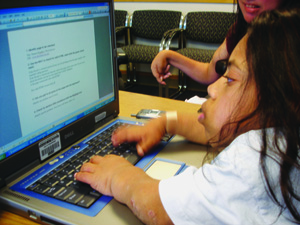 Photo of female student using a laptop computer
