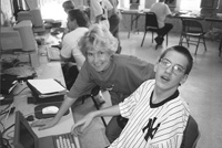 Photo of Sheryl Burgstahler and Trent in the computer lab