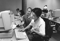 Photo of Nguyen and Tony in the computer lab