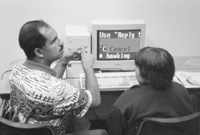Photo of Beppin and Kristin in the computer lab.