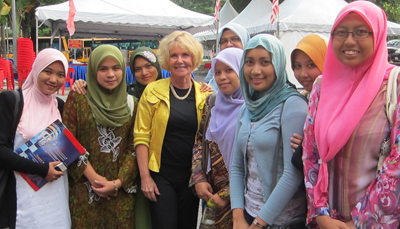 Sheryl Burgstahler poses for a photo with female students from the University of Malaysia. Photo of DO-IT director Sheryl Burgstahler poses for a photo with female students from the University of Malaysia.