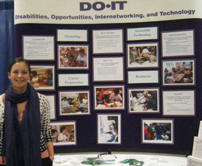 DO-IT staff member Brianna standing beside the DO-IT Display Booth. Photo of DO-IT staff member Brianna standing beside the DO-IT Display Booth.