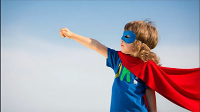 Image of boy dressed in a super hero costume