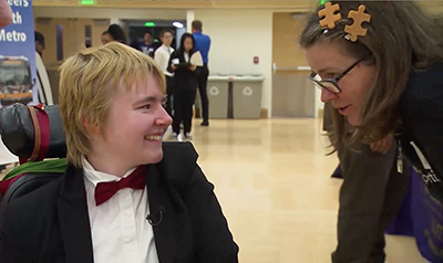 A student chats with a recruiter during a job fair.