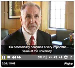 Image of man talking about accessibility on a video.