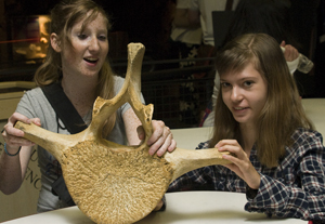 Photo of two DO-IT Scholars with a fossil