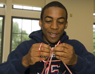 DO-IT Scholar holding several ribbons. Photo of DO-IT Scholar holding several ribbons.