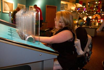 Photo of DO-IT Scholar using tools at the Pacific Science Center.