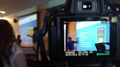Stan Lim of Scholarship Junkies giving a PowerPoint presentation to DO-IT Scholars. Photo of Stan Lim of Scholarship Junkies giving a PowerPoint presentation to DO-IT Scholars.