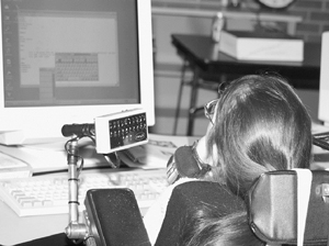 DO-IT Scholar uses computer for an activity in the DO-IT computer lab. Photo of DO-IT Scholar uses computer for an activity in the DO-IT computer lab.