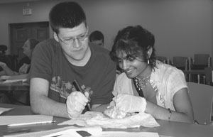 Image of two DO-IT Scholars dissecting a heart