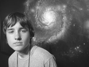DO-IT Scholar pictured with a nebula in the background. Image of a DO-IT Scholar pictured with a nebula in the background