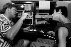 Photo of Hollis gets an explanation of the oscilloscope