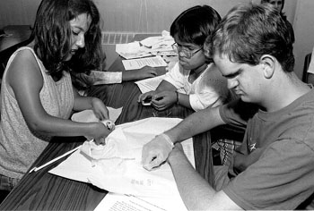 Photo of Veronica, Minh and Keaton working on their sheep heart bypass project