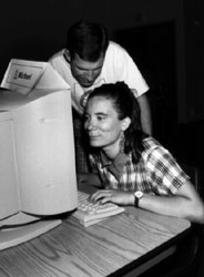 Photo of Darin helps Sherri at the computer