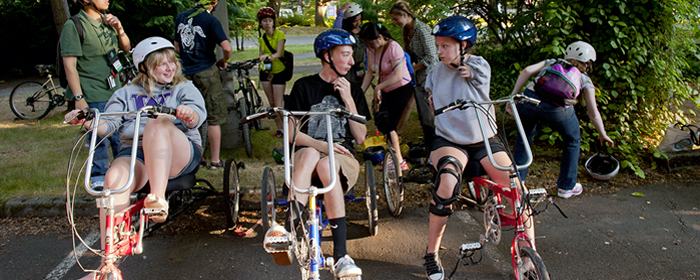 Participants riding accessible bicycles during Outdoors for All Image of participants riding accessible bicycles during Outdoors for All