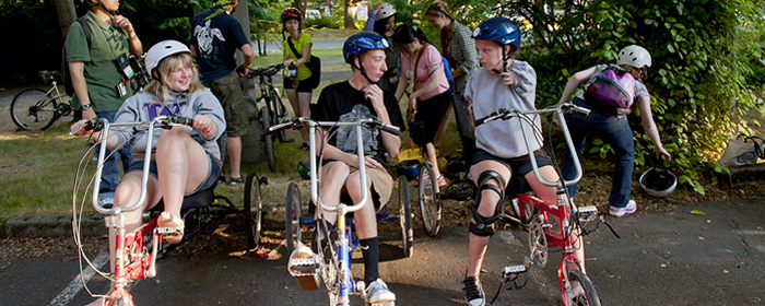 Image of participants riding accessible bicycles during Outdoors for All