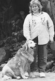 DO-IT staffer Cynthia with her dog. Picture of DO-IT staffer Cynthia with her dog.