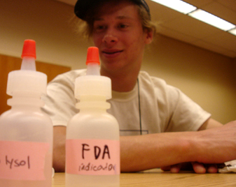 Photo of a student at a lab experiment