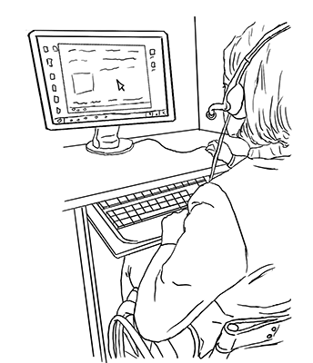 A student uses the computer while wearing a headset. A student uses the computer while wearing a headset.